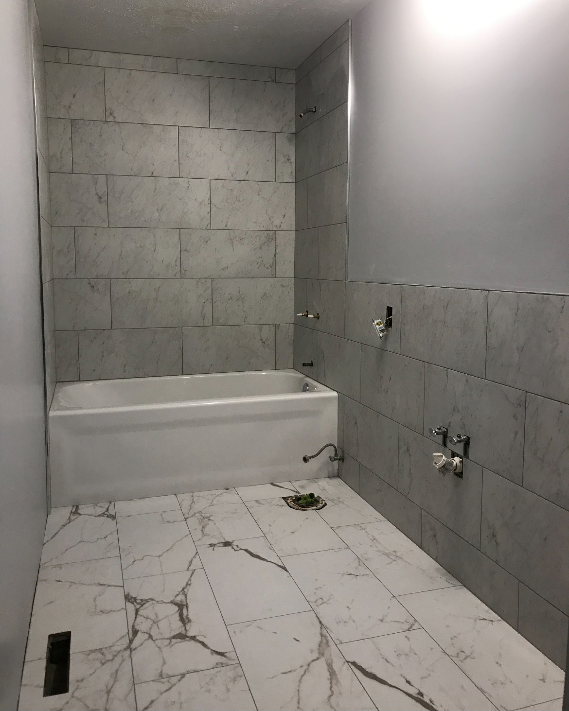 bathroom with white tile floor and grey walls